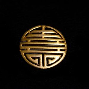 Ancient motive TBM sighed Chunky gold tone broch.